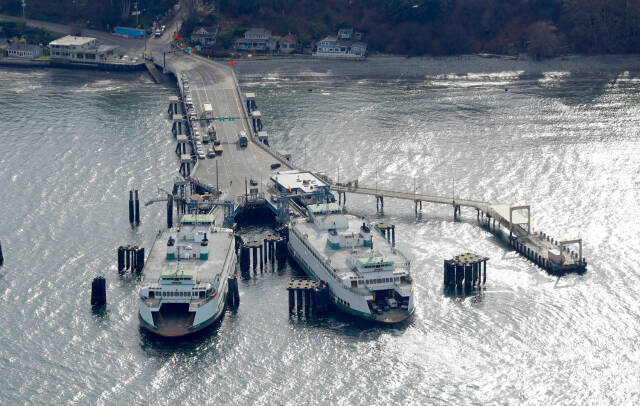 Washington state ferries are docked on the north end of Vashon Island on Feb. 23, 2018. (AP Photo/Ted S. Warren)