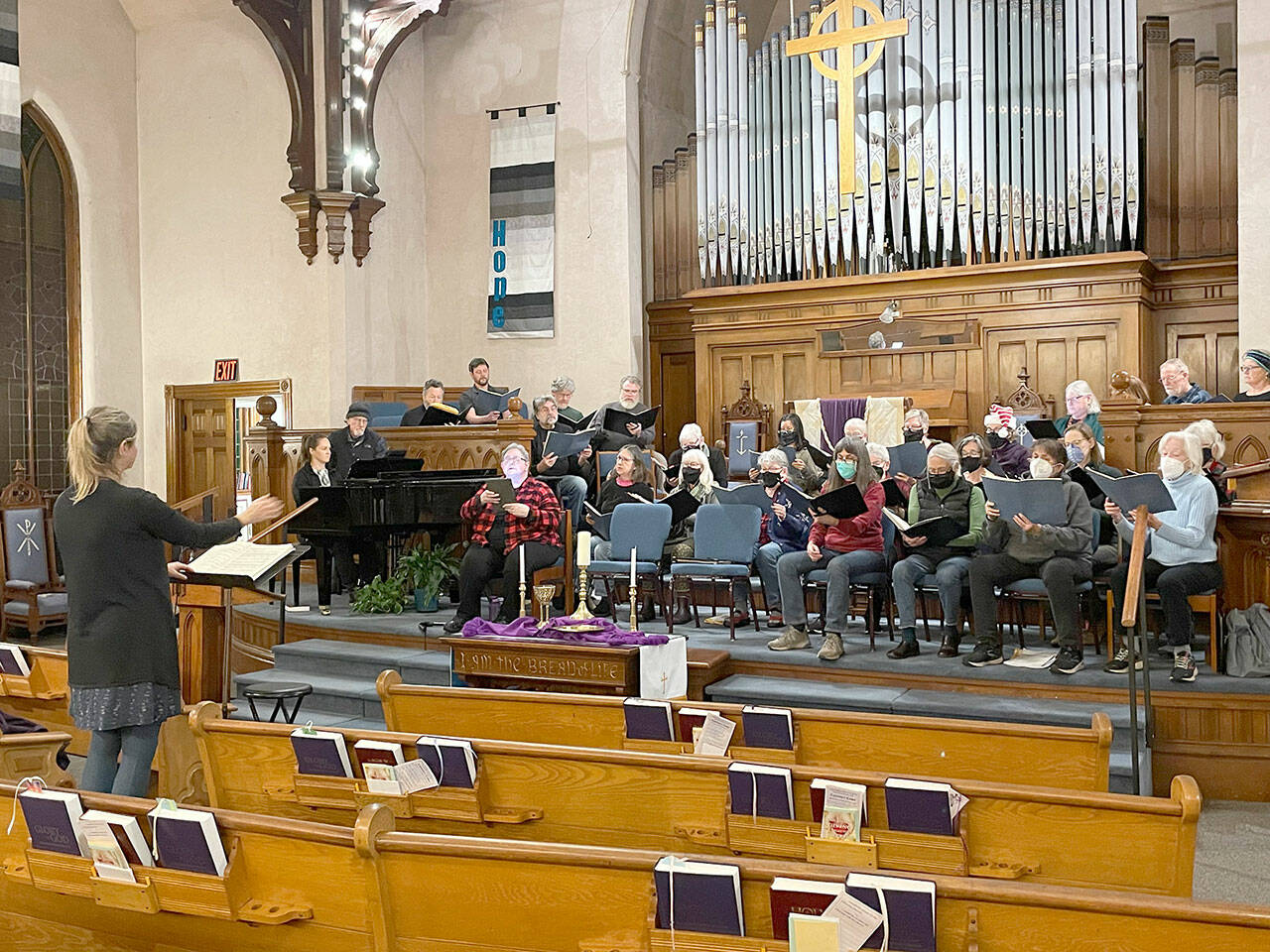 Director Sarah Moran rehearses the Community Chorus for a pair of holiday concerts in Port Townsend and Chimacum on Friday and Saturday. (photo by Lynn Nowak)