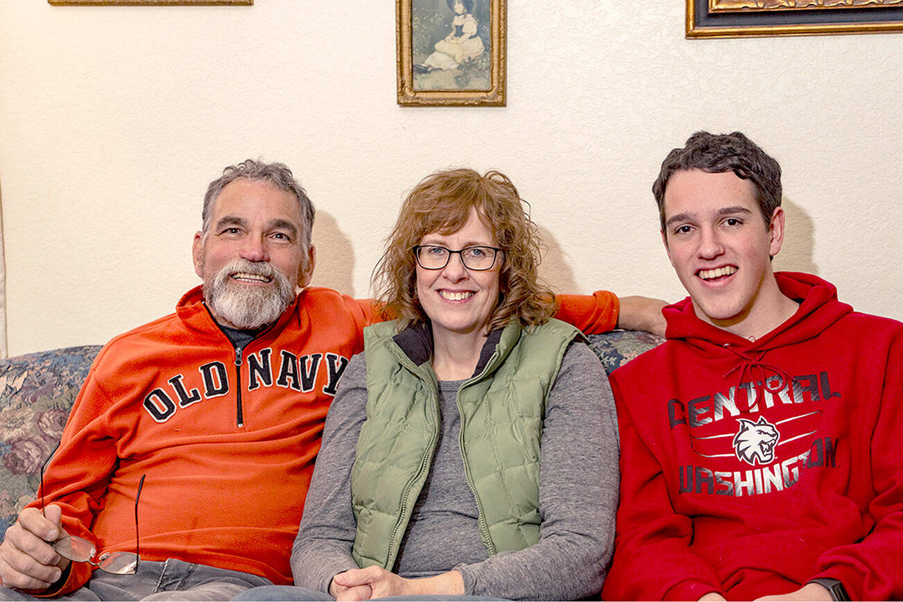 Steve Mullensky/for Peninsula Daily News

The McKenzie family, Ian, Lori and son Joshua, at home in Port Townsend on Thursday.