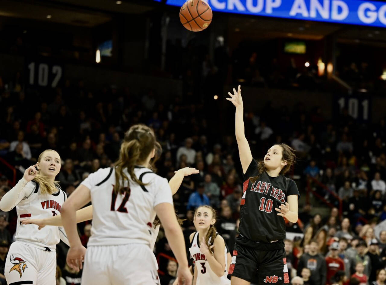Bridget Mayfield/for Peninsula Daily News
Neah Bay's Allie Greene shoots over the Mossyrock defense on March 4 in Spokane in the 1B state championship game. Greene led the Red Devils with 19 points to help the Neah Bay girls win the state championship 56-54. She now plays for Peninsula College.