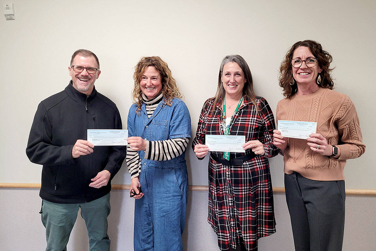 Pictured from left to right are Marty Brewer, Port Angeles School District superintendent; Michelle Turner, Port Angeles Education Foundation president; Michell Gentry, Port Angeles AmeriCorps coordinator; and Kayla Oakes, Field Arts and Events Hall.