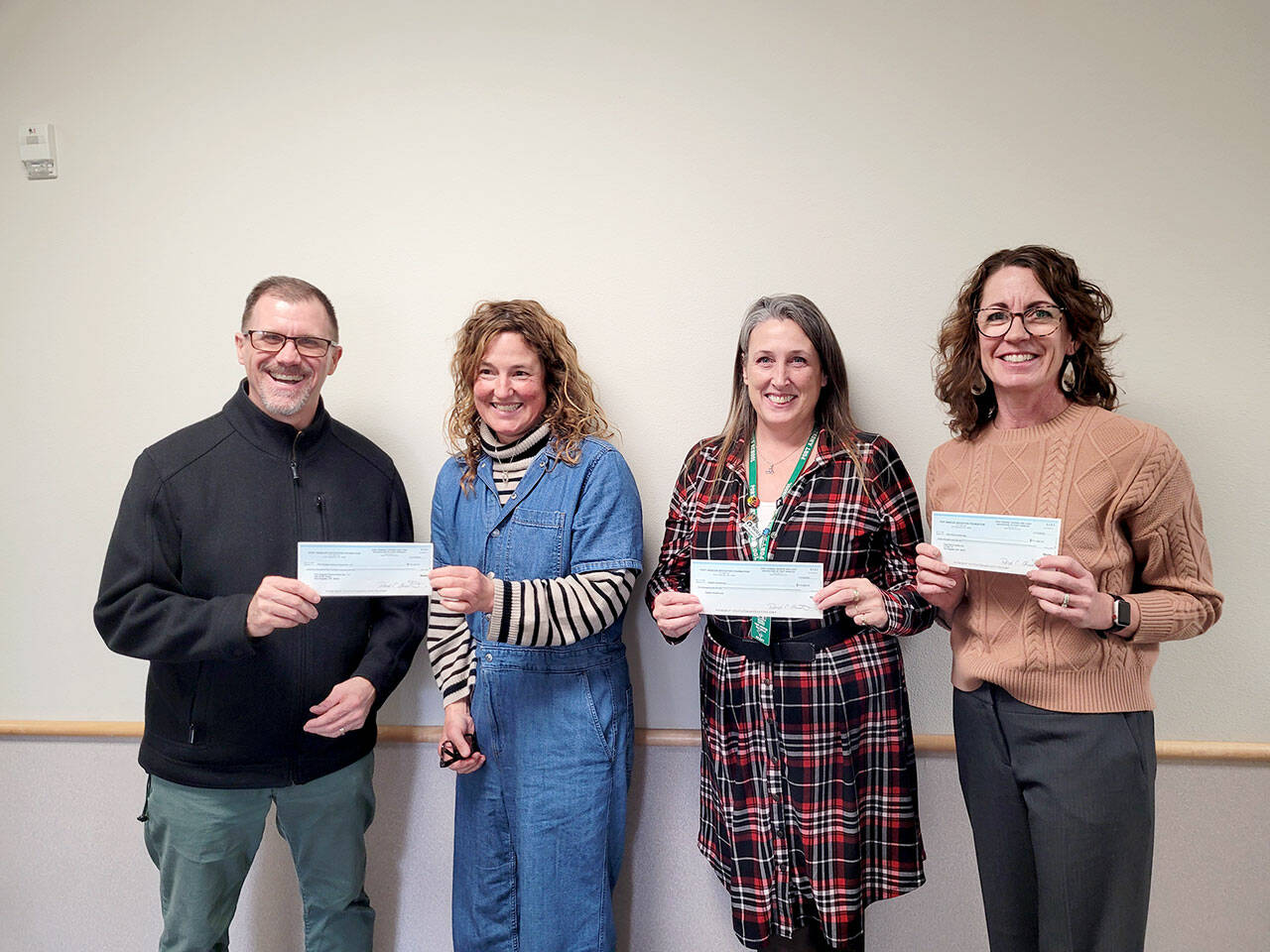 Pictured, left to right, are Marty Brewer, Port Angeles School District superintendent; Michelle Turner, Port Angeles Education Foundation president; Michell Gentry, Port Angeles AmeriCorps coordinator; and Kayla Oakes, Field Arts and Events Hall.
