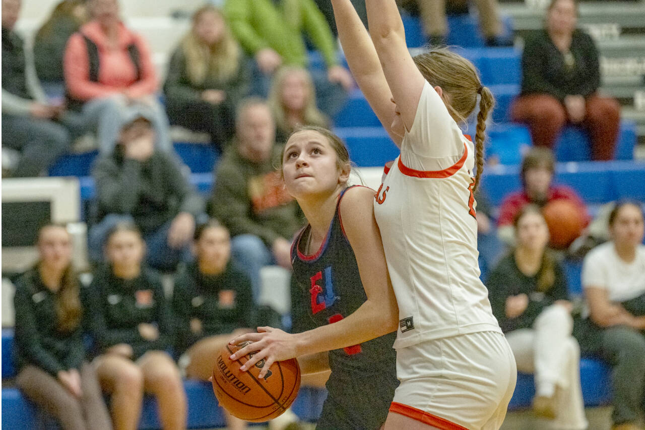 East Jefferson’s Kateyn Riley keeps her eyes on the basket while being closely guarded against Washougal on Saturday in Chimacum. (Steve Mullensky/for Peninsula Daily News)