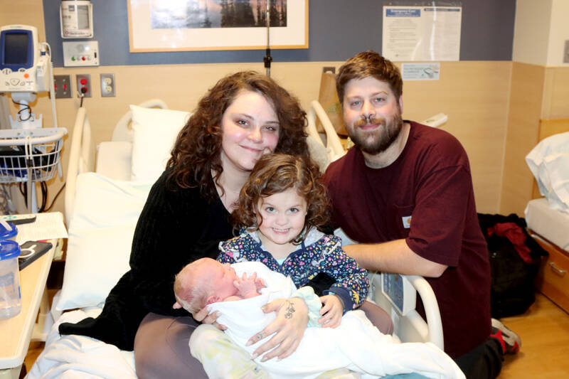 Sierra and Jeremy Springer of Sequim with children Poppy and newborn Fiona, who was the first baby born in Clallam County in 2024 at Olympic Medical Center in Port Angeles. (Dave Logan/for Peninsula Daily News)