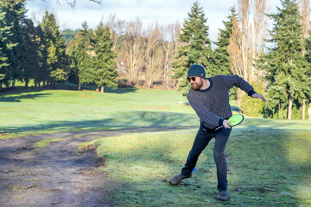 Jamison Orr of Port Townsend tees off on the first hole during a demonstration round of disc golf at the Port Townsend Golf Park on Monday during an open house marking the change in management by the nonprofit Friends of the Port Townsend Golf Park. The disc course measures about 6,800 feet in length and is played over part of the same layout as the golf course. (Steve Mullensky/for Peninsula Daily News)