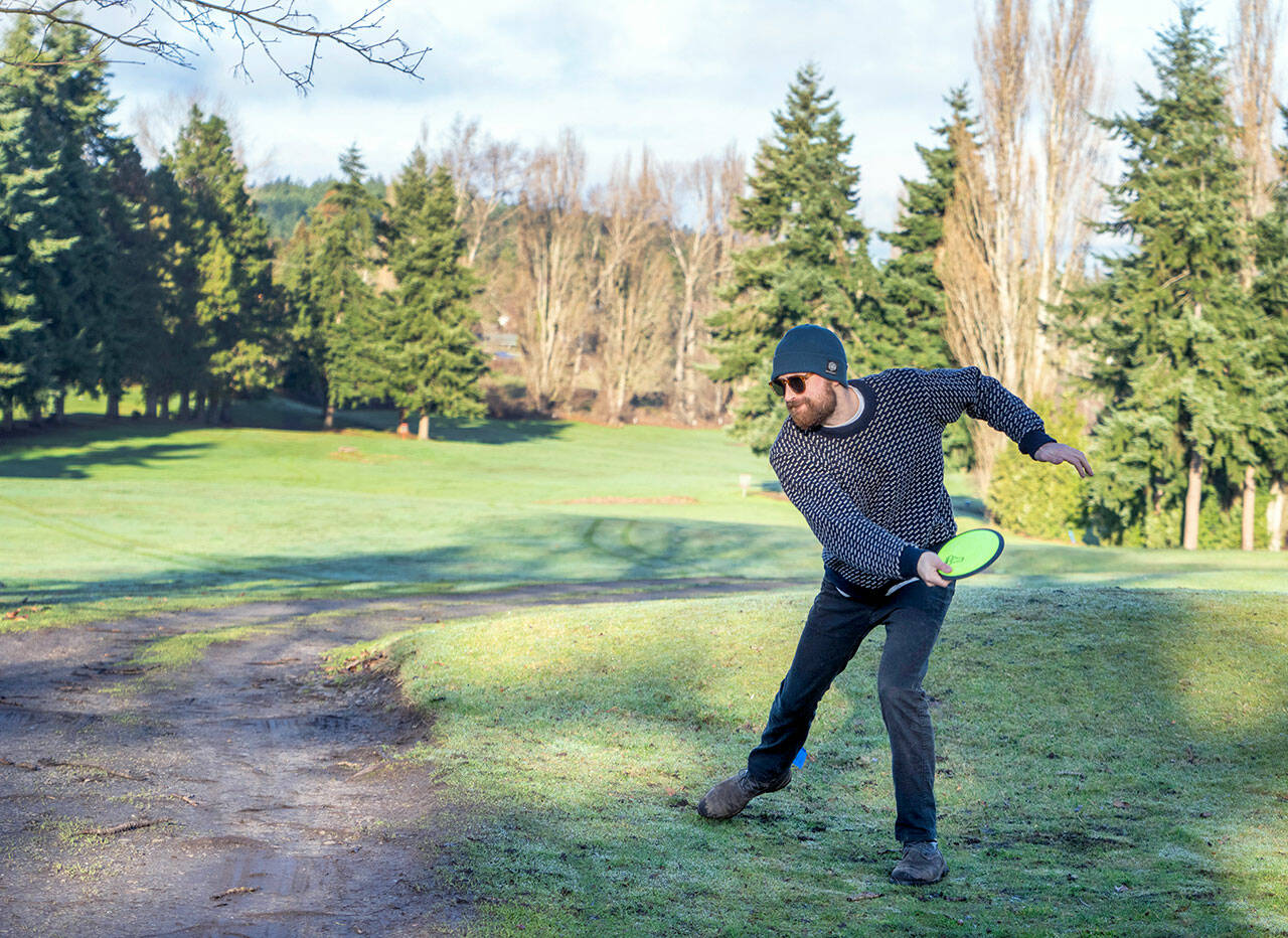 Jamison Orr of Port Townsend tees off on the first hole during a demonstration round of disc golf at the Port Townsend Golf Park on Monday during an open house marking the change in management by the nonprofit Friends of the Port Townsend Golf Park. The disc course measures about 6,800 feet in length and is played over part of the same layout as the golf course. (Steve Mullensky/for Peninsula Daily News)