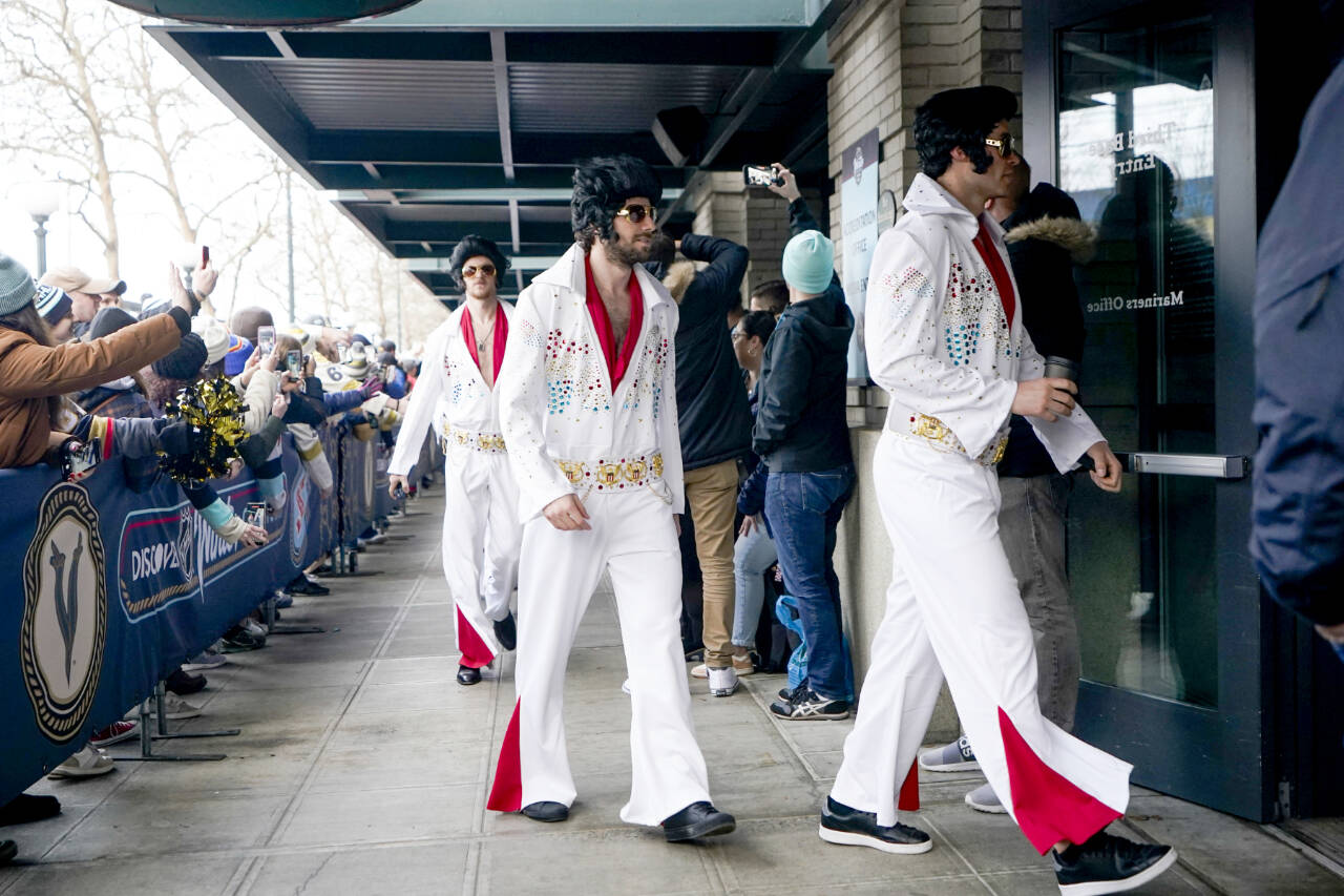 The Vegas Golden Knights arrive dressed like Elvis before the NHL Winter Classic hockey game against the Seattle Kraken, Monday, Jan. 1, 2024, in Seattle. (Lindsey Wasson/The Associated Press)
