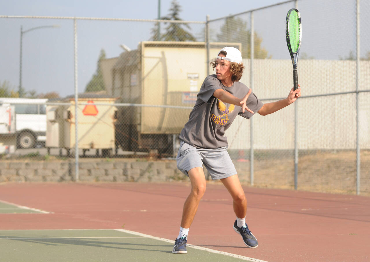 Sequim’s Garrett Little returns a shot as he takes on North Kitsap’s Indigo Gallagher-Zapf in No. 1 singles play on Sept. 13. (Michael Dashiell/Olympic Peninsula News Group)