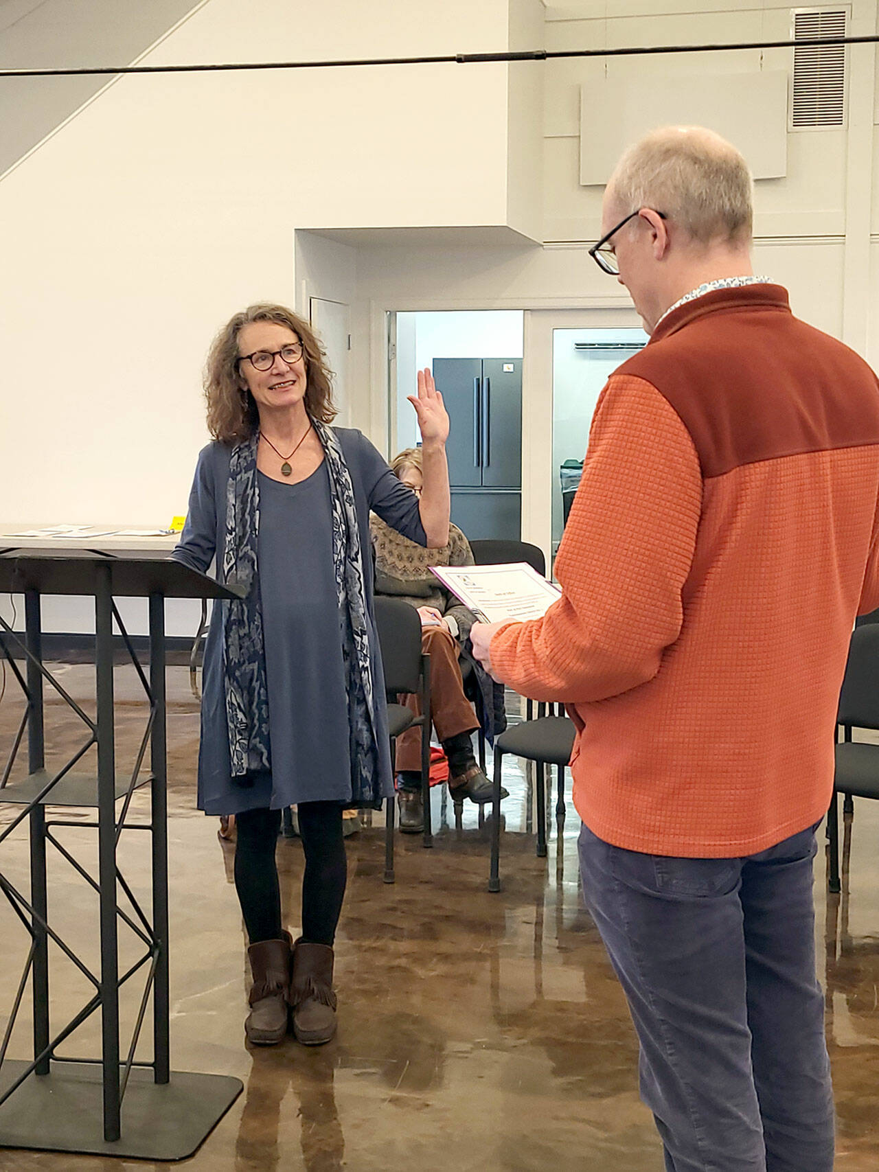 Pam Petranek, left, is sworn in for her second term as a Port of Port Townsend commissioner on Jan. 10 by Executive Director Eron Berg. (Photo courtesy Port of Port Townsend)