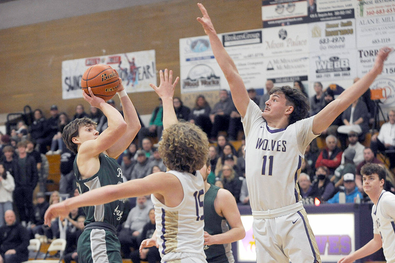 Michael Dashiell/Olympic Peninsula News Group
Port Angeles' Parker Nickerson shoots while defended by Sequim's Zeke Schamedke, center, and Charlie Grider during the Riders' 77-52 Rainshadow Rumble rivalry victory Thursday.