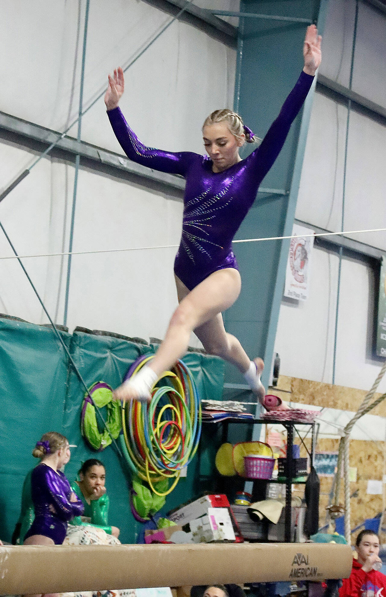 Susannah Sharp of Sequim, competing for the joint Port Angeles/Sequim gymnastics team, preforms on the balance beam Monday at a meet in Port Angeles against Bainbridge. Bainbridge edged Port Angeles/Sequim 164-139. (Dave Logan/for Peninsula Daily News)