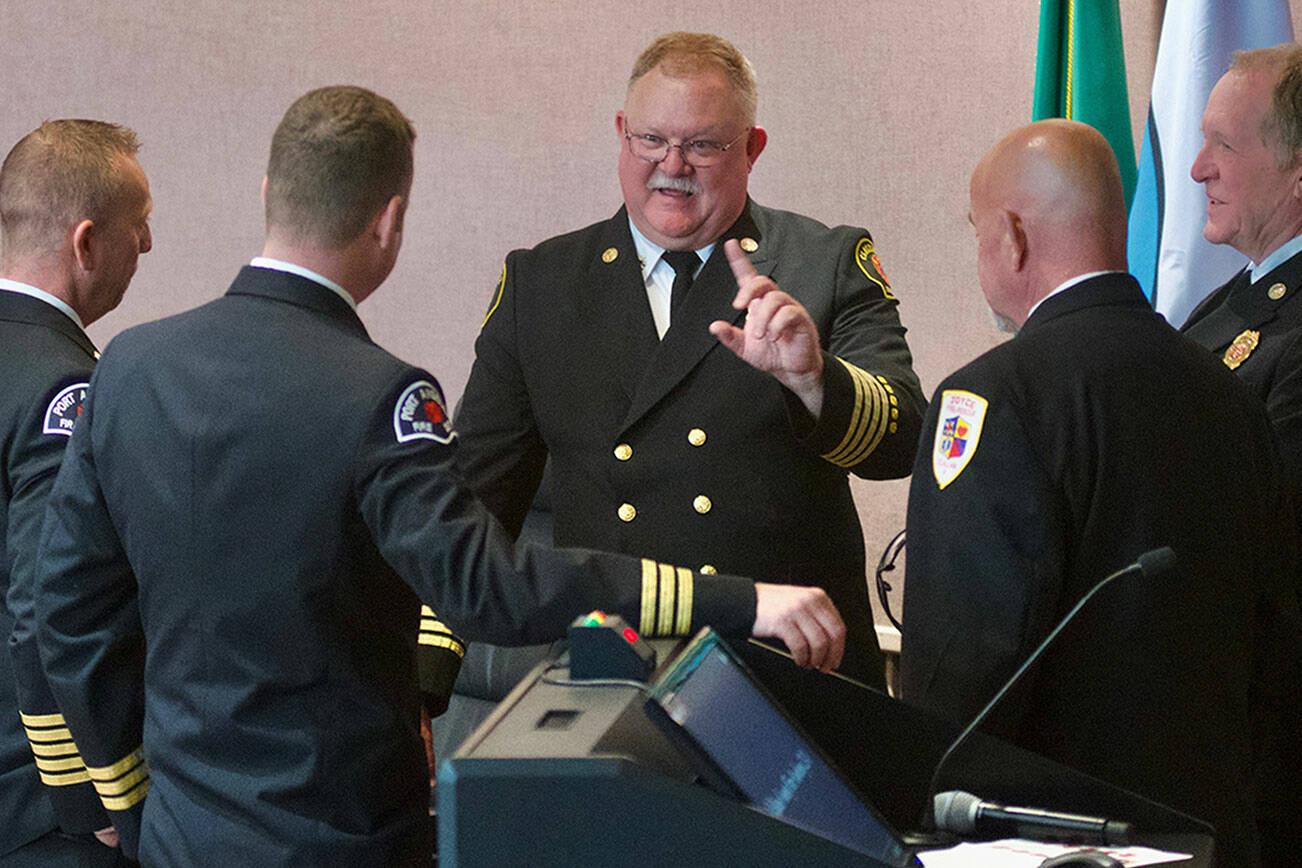 Deputy chief Justin Grider with Clallam County Fire District 2, center, has accepted an offer to become Fire District 3’s next fire chief. Here he stands with, from left, Port Angeles Fire Department Chief Derrell Sharp, Joel McKeen, Port Angeles Fire Department assistant chief, Joyce Fire and Rescue chief Greg Waters and Fire District 3 interim fire chief Dan Orr. (Jay Cline)