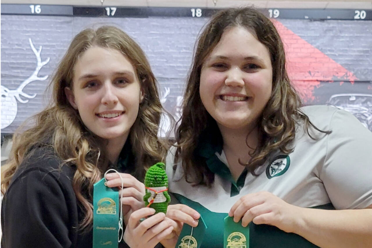 From left, Port Angeles’ Paige Pangaro and Abby Robinson both qualified for the girls state bowling tournament for the second straight year.