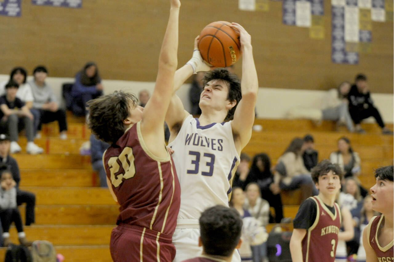Sequim’s Jamison Gray goes up for a shot against Kingston in Sequim on Tuesday. The Wolves won 63-50 as six players scored at least eight points. (Michael Dashiell/Olympic Peninsula News Group)