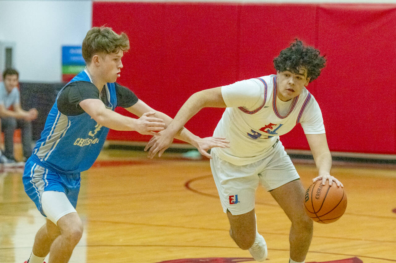 East Jefferson’s Keidan Guzman drives the ball against Bellevue Christian on Friday. Guzman finished with 13 points, six assists and eight rebounds in the Rivals’ victory to keep them at .500 in the Nisqually League. (Steve Mullensky/for Peninsula Daily News)