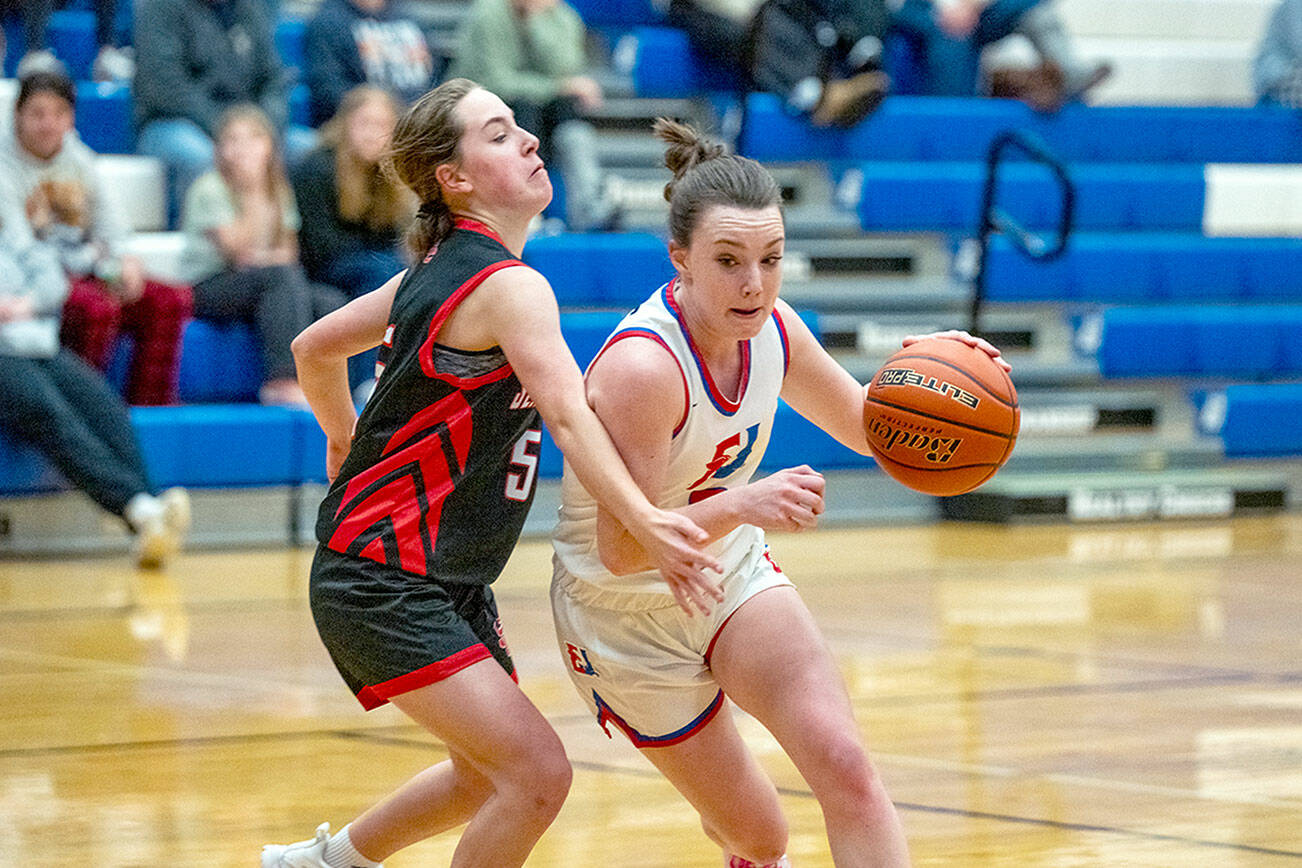 East Jefferson Rival Kay Botkin pushes around Seattle Christian Warrior Trista Vanderveer during a Nisqually League game played in Chimacum on Monday. (Steve Mullensky/for Peninsula Daily News)