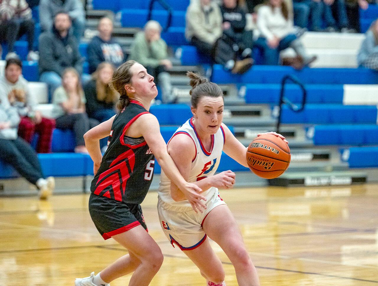 East Jefferson Rival Kay Botkin pushes around Seattle Christian Warrior Trista Vanderveer during a Nisqually League game played in Chimacum on Monday. (Steve Mullensky/for Peninsula Daily News)