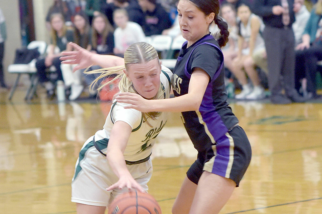 KEITH THORPE/PENINSULA DAILY NEWS 
Port Angeles' Izzy Felton, left, pushes past Sequim's Graciela Chartraw on Tuesday evening at Port Angeles High School.