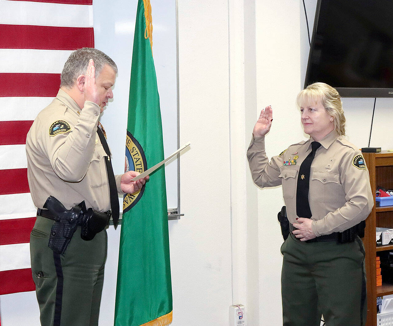 Lorraine Shore is sworn in as undersheriff by Clallam County Sheriff Brian King. (Dave Logan/for Peninsula Daily News)