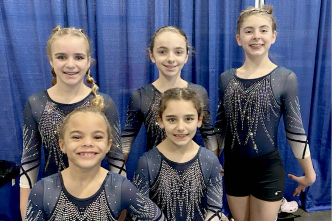 The Klahhane XCel Gold team of Carly Mae Riggs, Paytynn Lindley, Gracelyn Goss, Lainey DePiro and Raynee Ciarlo took first place at the Realm Classic gymnastics meet this weekend in Everett. (Courtesy photo)