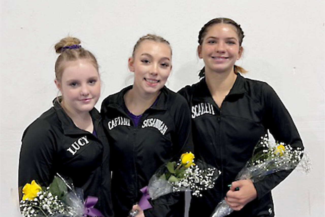 From left, Sequim’s Lucy Spelker and Susannah Sharp and Port Angeles’ Scarlett Sullivan all qualified for the state gymnastics meet Friday. (Courtesy photo)