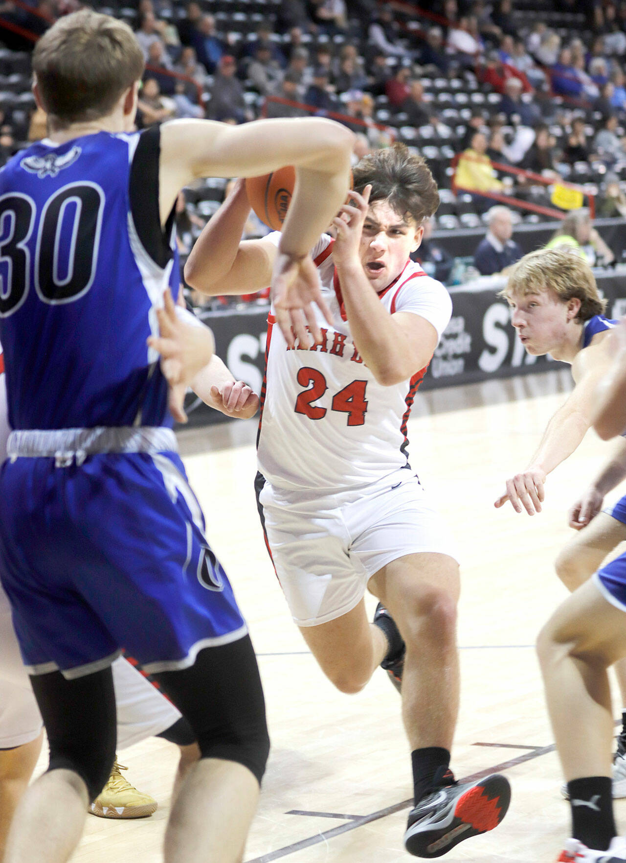 Neah Bay’s Tyler Swan drives to the hoop during the Red Devils Class 1B state boys basketball tournament opener against Oakesdale at the Spokane Arena. (Roger Harnack/Cheney Free Press)