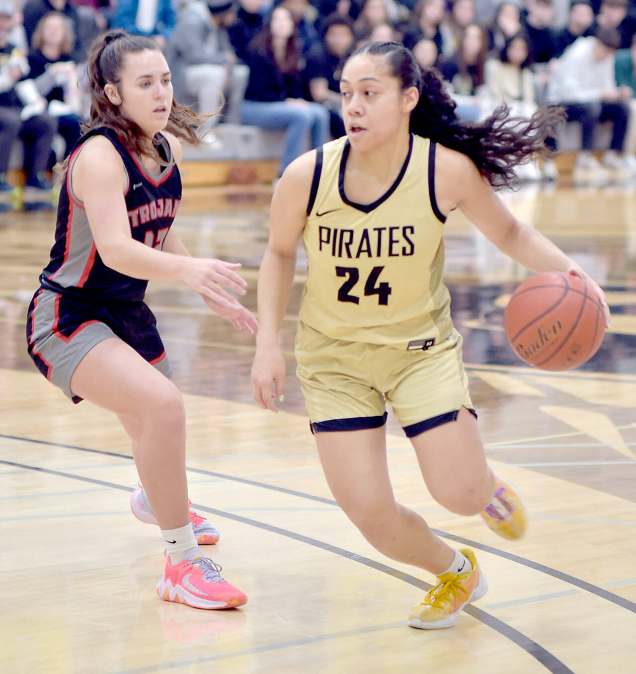 Peninsulas Shania Moananu, right, crosses the 3-point line as Everetts Ashlynd Hunt tries to keep up in a Feb. 28 game at Peninsula College. Moananu, a point guard, was named the North Region MVP and freshman of the year. (Keith Thorpe/Peninsula Daily News)