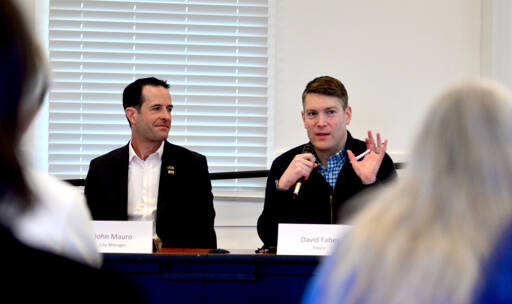 Port Townsend City Manager John Mauro, left, and Mayor David Faber speak during the city’s annual State of the City address at the Port Hudson building in Port Townsend on Monday. Faber and Mauro said the city faced some challenges in 2023 but also made progress on important issues like housing and infrastructure. (Peter Segall/Peninsula Daily News)
