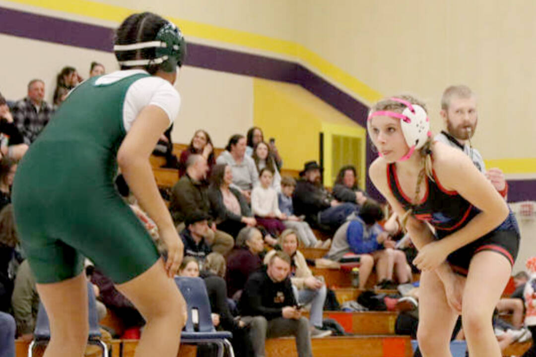 Chimacum seventh-grader Leighton Dunn stalks her opponent, Miles Hill of Port Angeles, at Blue Heron Middle School in Port Townsend last week. Dunn earned three takedowns only to fall in the second round in a pin. (Ryan White)