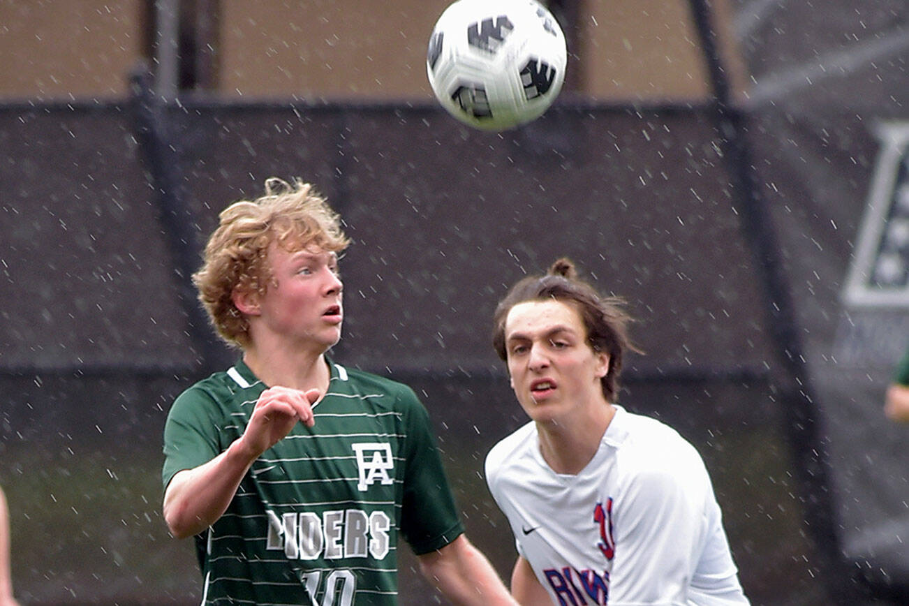 KEITH THORPE/PENINSULA DAILY NEWS
Port Angeles' Matthew Miller, left, takes control of the ball ahead of East Jefferson's Zephy Bell on Saturday at Peninsula College.