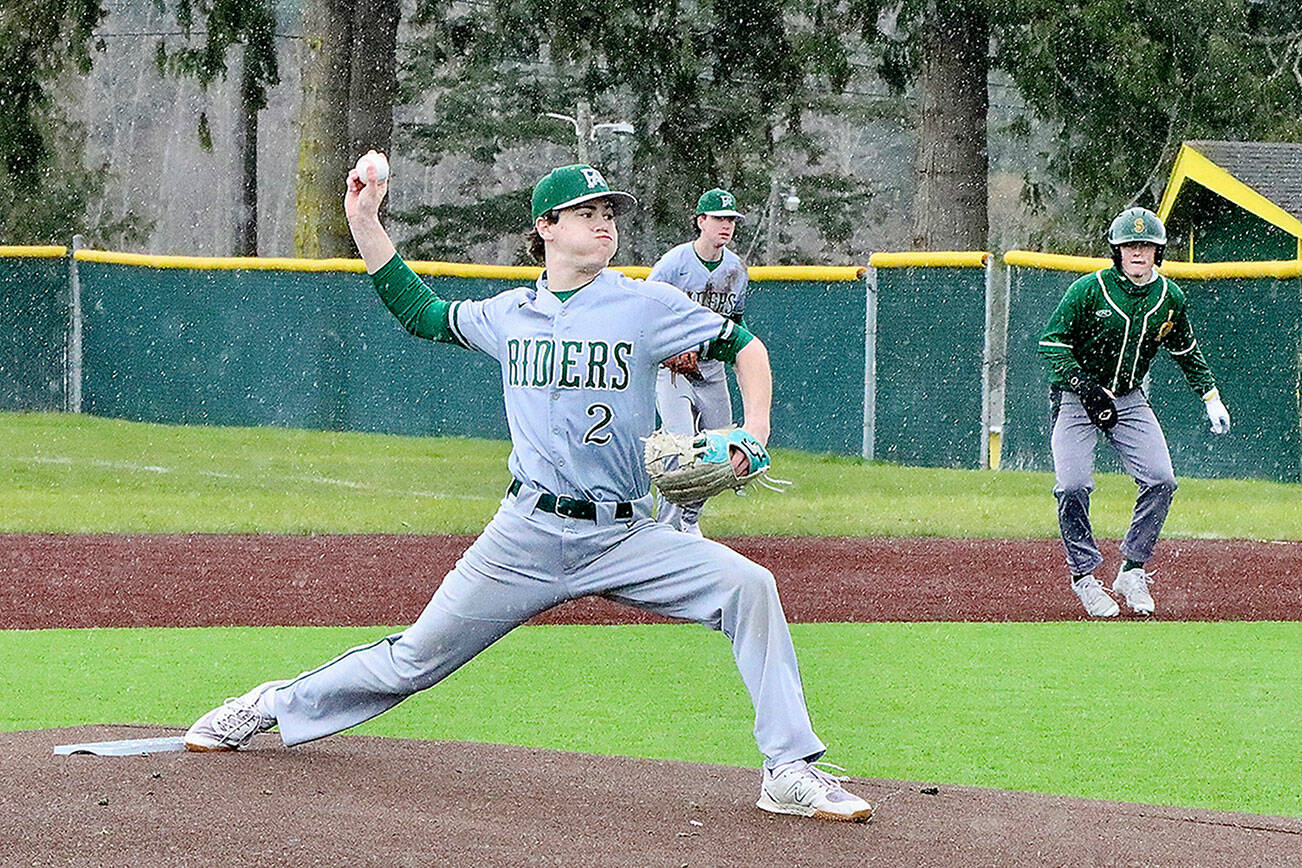 PA ’s starting pitcher Alex Angevine fires a pitch to home during the rainy game. dlogan