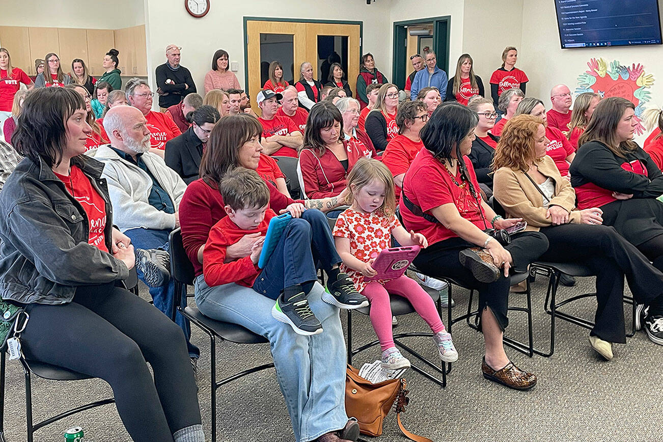 More than 100 educators appeared at Thursday’s Port Angeles School District board meeting to show their support for paraeducators, who are seeking a 3.7 percent pay raise and have been working without a contract since Aug. 31. (Paula Hunt/Peninsula Daily News)