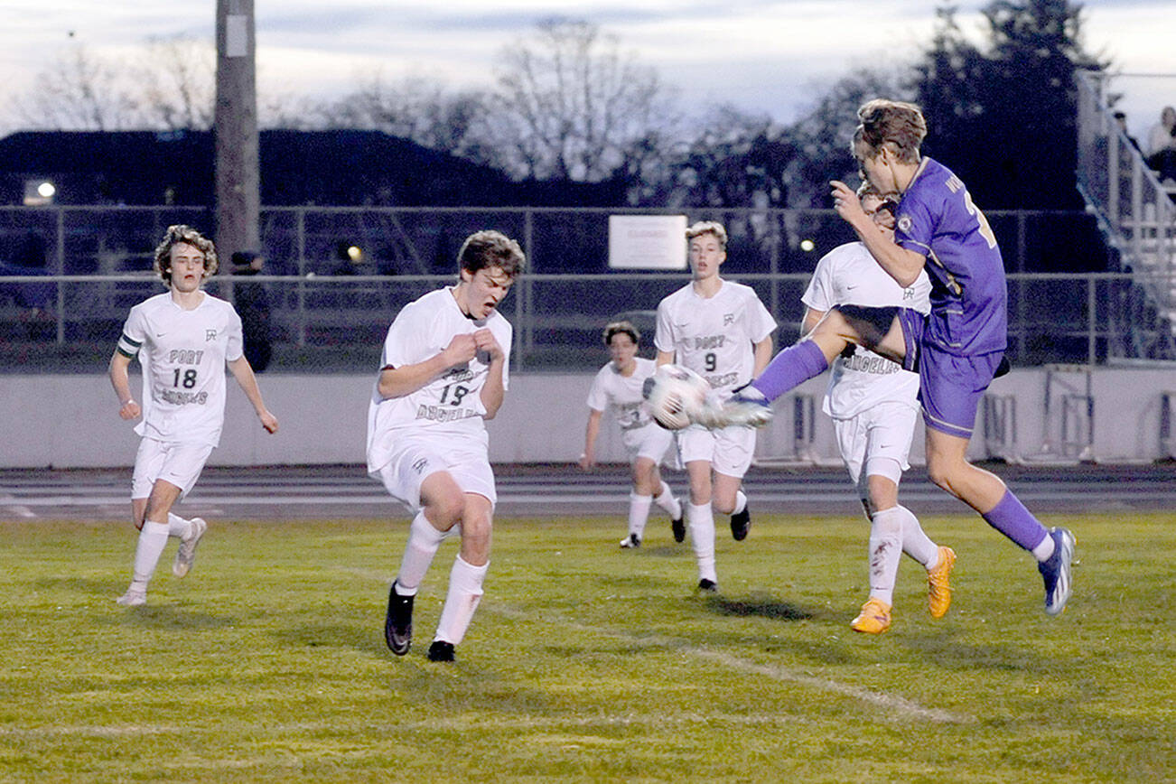 Matthew Nash/for Olympic Peninsula News Group
Sequim's Preston Kurtze puts a boot to the ball while surrounded by Port Angeles defenders' Grant Butterworth, Jackson Wyall, Myles Close, Aurelio Wilson-Rojero and Caleb Lagrange (obscured) during the Wolves' 4-2 win Thursday night.