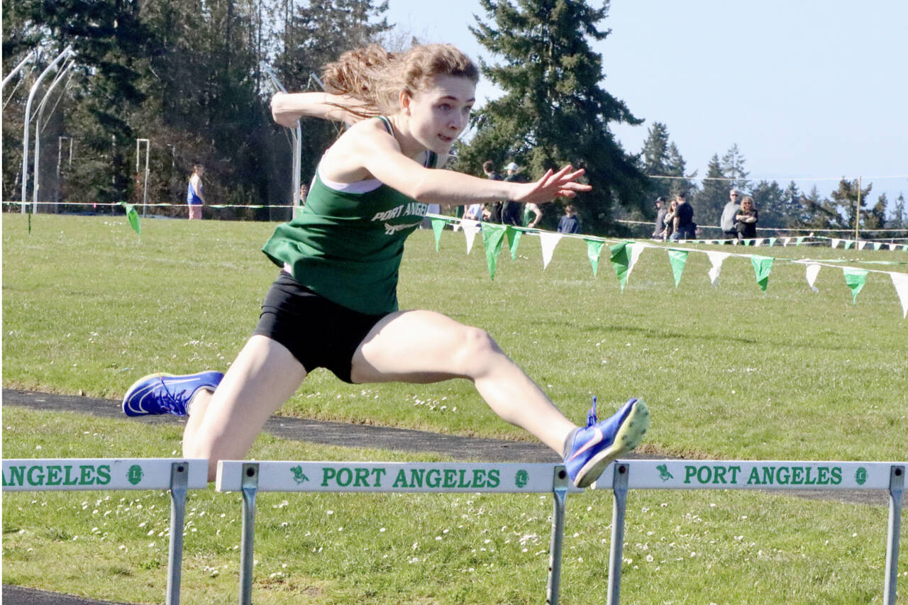 Dave Logan/for Peninsula Daily News
Port Angeles' Faerin Tait runs the hurdles in the Roughriders home track meet Monday at Port Angeles High School. Tait won the 100 and 300 hurdles and the 200-meter sprint.