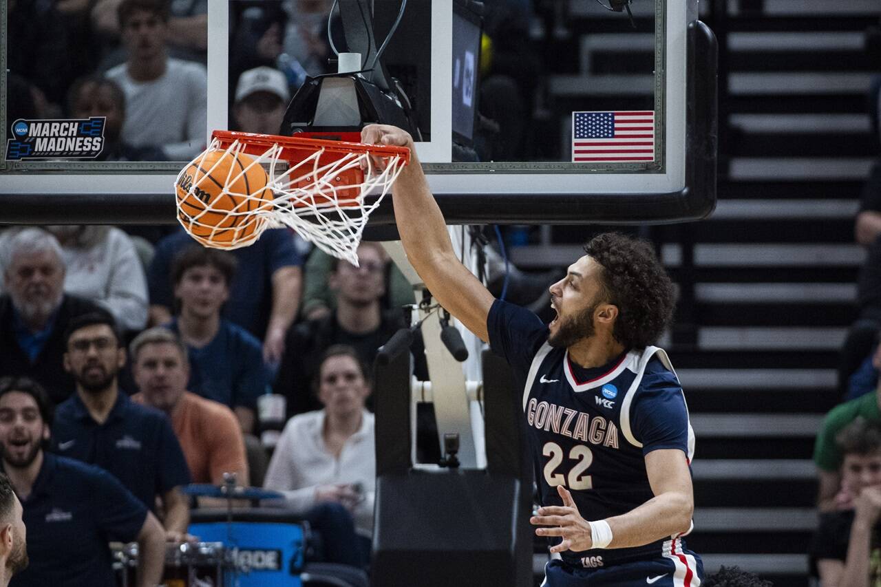 Gonzaga forward Anton Watson (22) dunks against Kansas during the second half of a second-round college basketball game in the NCAA Tournament in Salt Lake City, Saturday, March 23, 2024. (AP Photo/Isaac Hale)