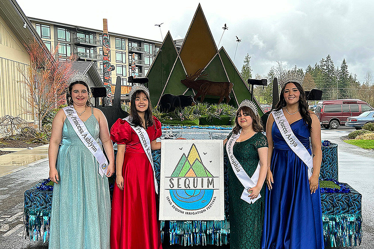 Sequim Irrigation Festival royalty, from left, Princess Ashlynn Northaven, Princess Kailah Blake, Princess Sophia Treece and Queen Ariya Goettling stand with their new float that they’ll ride on for 14 parades this year. It was shown to them for the first time on Saturday at 7 Cedars Casino. (Matthew Nash/Olympic Peninsula News Group)