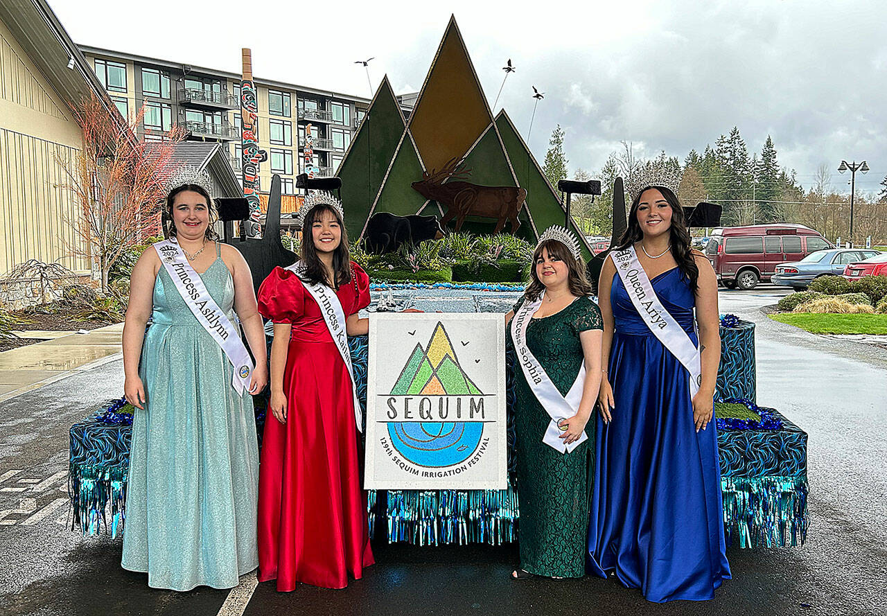 Sequim Irrigation Festival royalty, from left, Princess Ashlynn Northaven, Princess Kailah Blake, Princess Sophia Treece and Queen Ariya Goettling stand with their new float that they’ll ride on for 14 parades this year. It was shown to them for the first time on Saturday at 7 Cedars Casino. (Matthew Nash/Olympic Peninsula News Group)