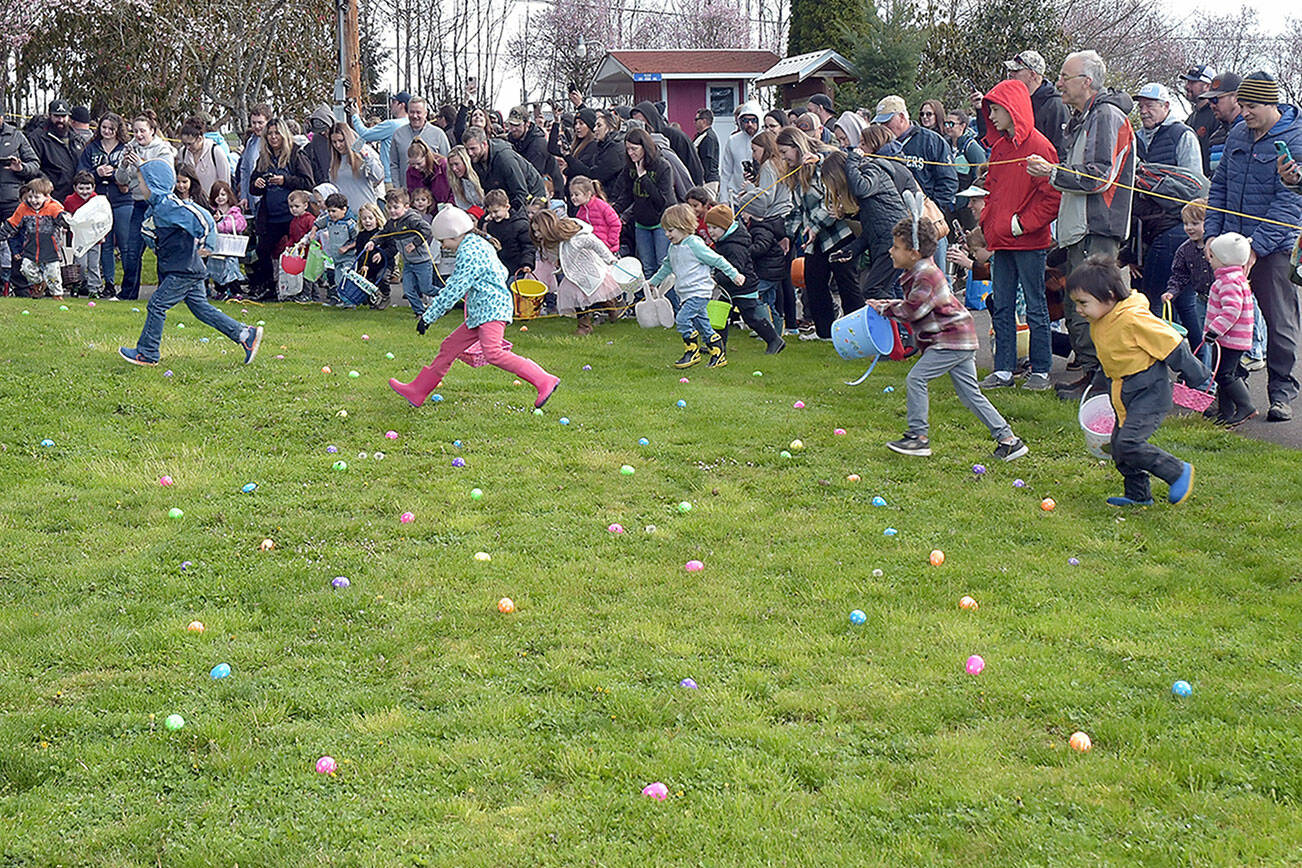 Children take off from the starting ropes in search of prize-filled eggs at the 46th annual KONP Easter Egg Hunt on Saturday at the Clallam County Fairgrounds in Port Angeles. Hundreds of youngsters took part in the event. (Keith Thorpe/Peninsula Daily News)