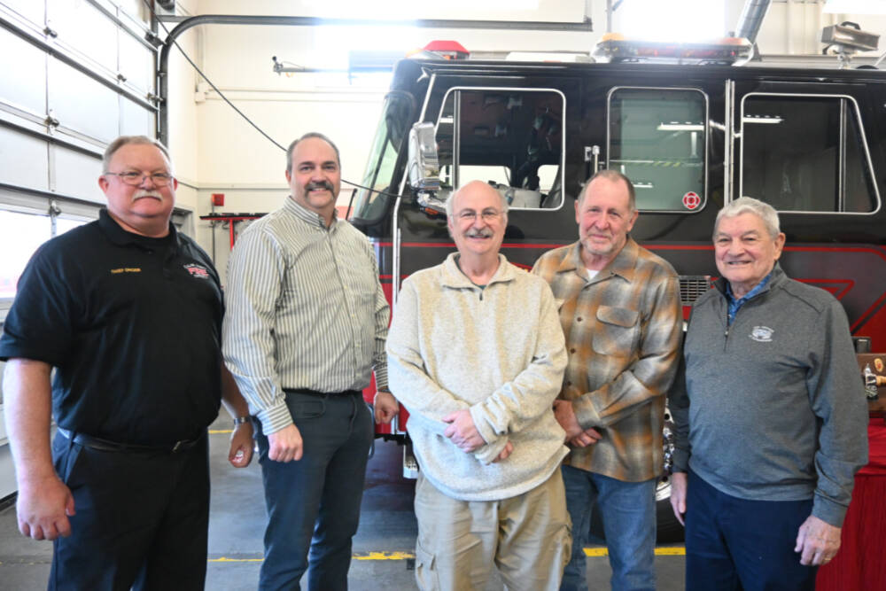 Current and former fire chiefs with Clallam County Fire District 3 gather to send off outgoing chiefs Ben Andrews and Dan Orr. Pictured, from left, are: current District 3 chief Justin Grider; Andrews; former chief Steve Vogel; Orr, and former chief Tom Lowe. (Michael Dashiell/Olympic Peninsula News Group)