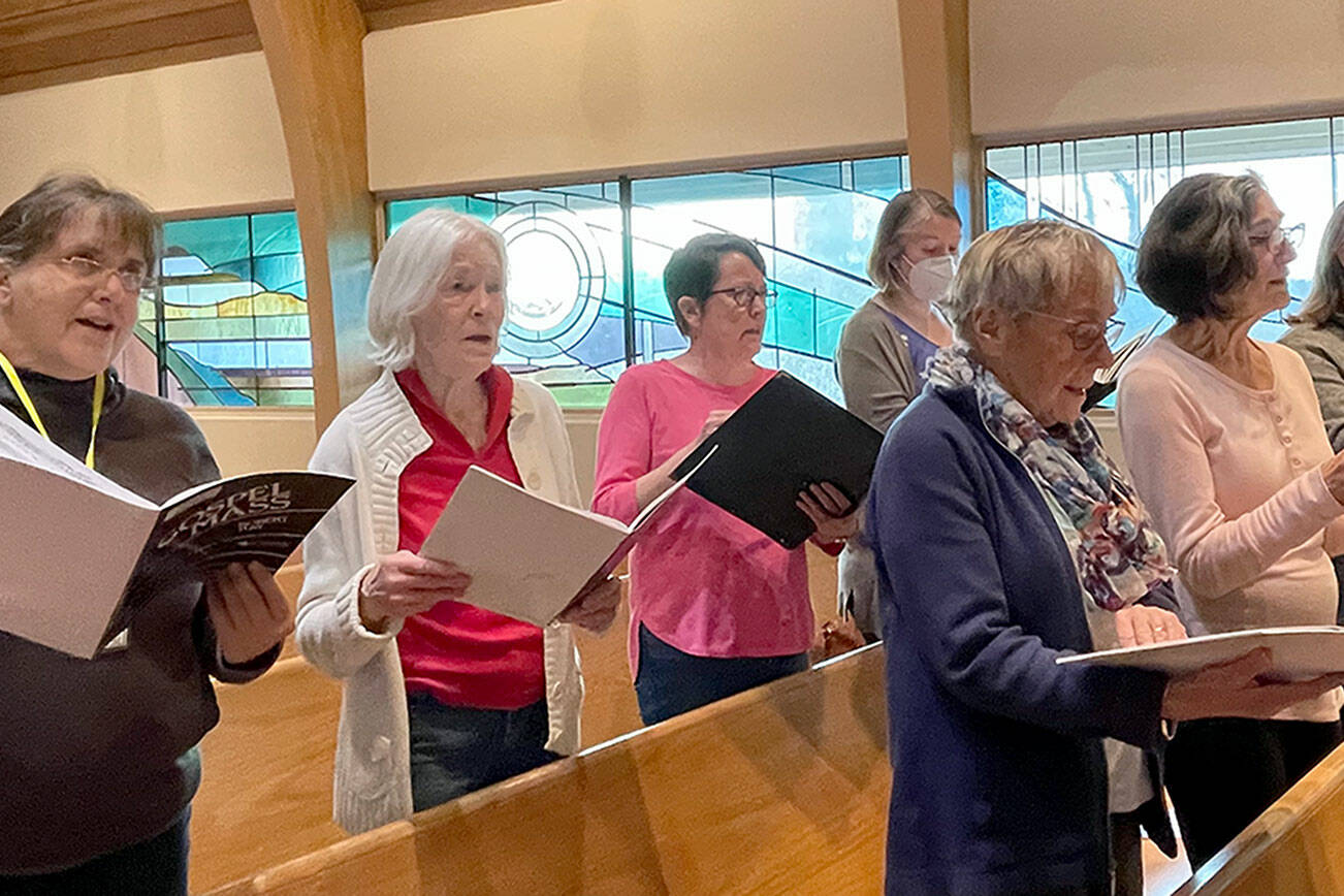 Sopranos rehearsing, back row, from left, Beth Cahape, Annalee McConnell, Joan Coyne and Amy Johnson; front row, from left, Judy Backman, Mardelle Hansen and Mar Oneppo.