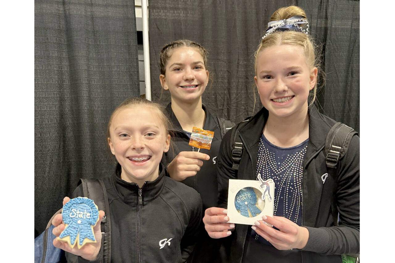 Klahhane Xcel gymnasts, from left, Elyse Brown, Mariah Traband and Scarlett Sullivan all qualified for regionals at the Washington State Xcel Championship held in Pasco this weekend. Brown won a first-place medal for the floor exercise. (Klahhane Gymnastics)