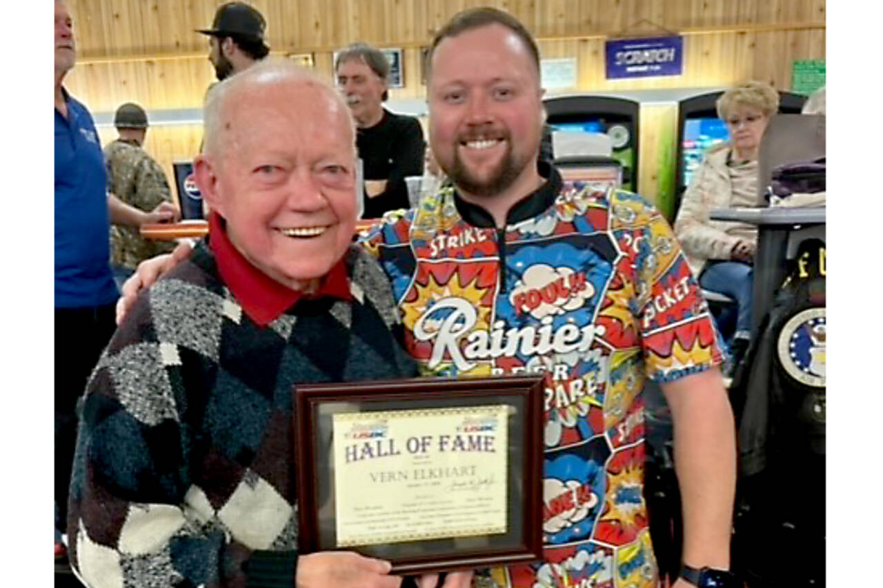 Laurel Lanes owner Vern Elkhart with Port Angeles Business Association president Anthony Sanders receiving his hall of fame plaque back in January. (Courtesy photo)
