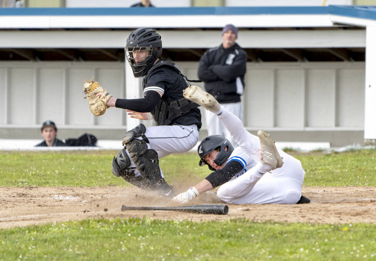 Steve Mullensky/for Peninsula Daily News
East Jefferson's Cash Holmes tumbles into home for a run during a game against Klahowya on Monday in Chimacum. Despite the Eagles coming in to Monday's game as the defending 1A state champion, East Jefferson gave Klahowya a tough game, but fell in the end 5-4.