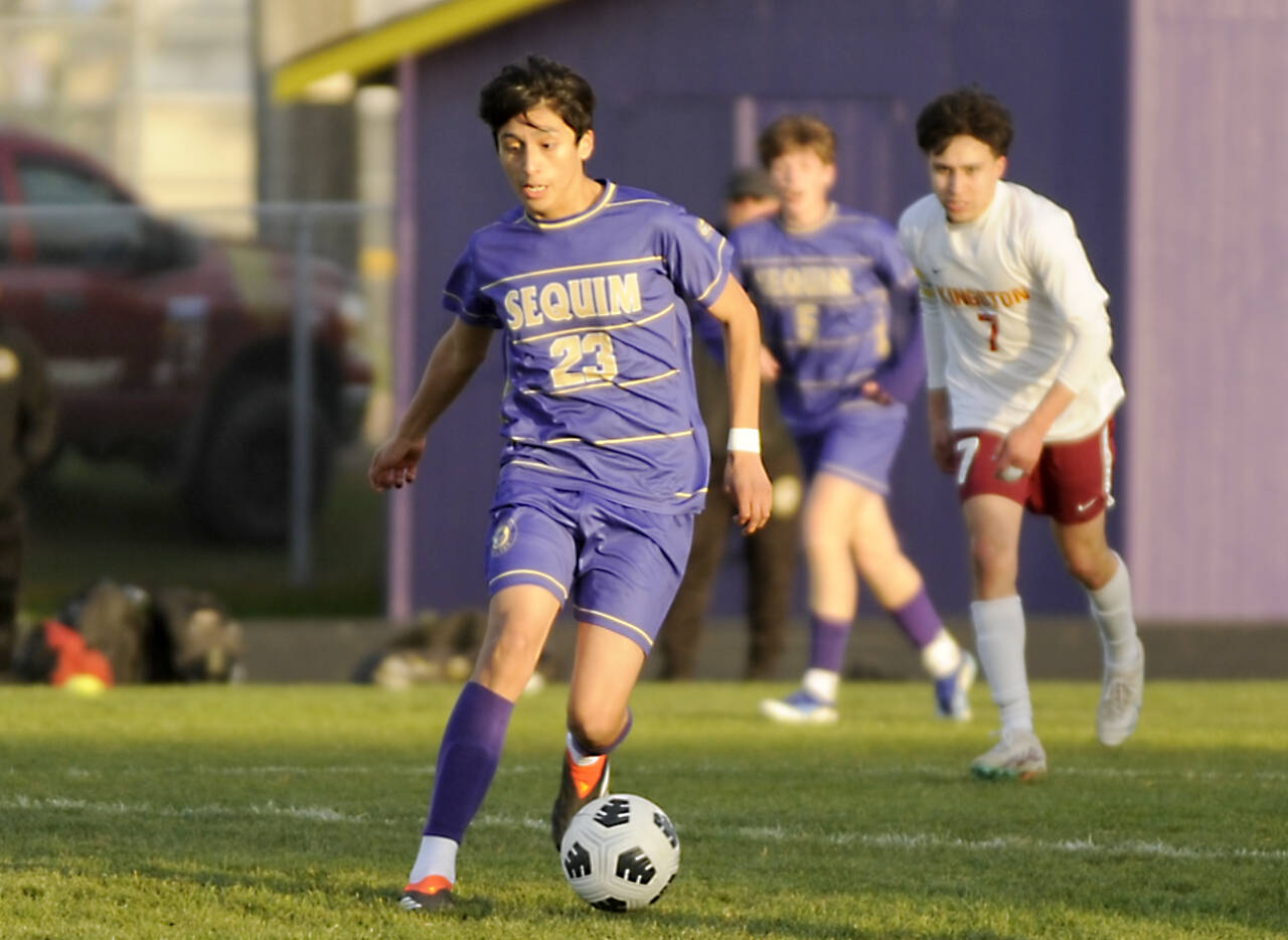 Sequim's Guillermo Salgado dribbles the ball against Kingston in Sequim on Tuesday. (Michael Dashiell/for Peninsula Daily News)