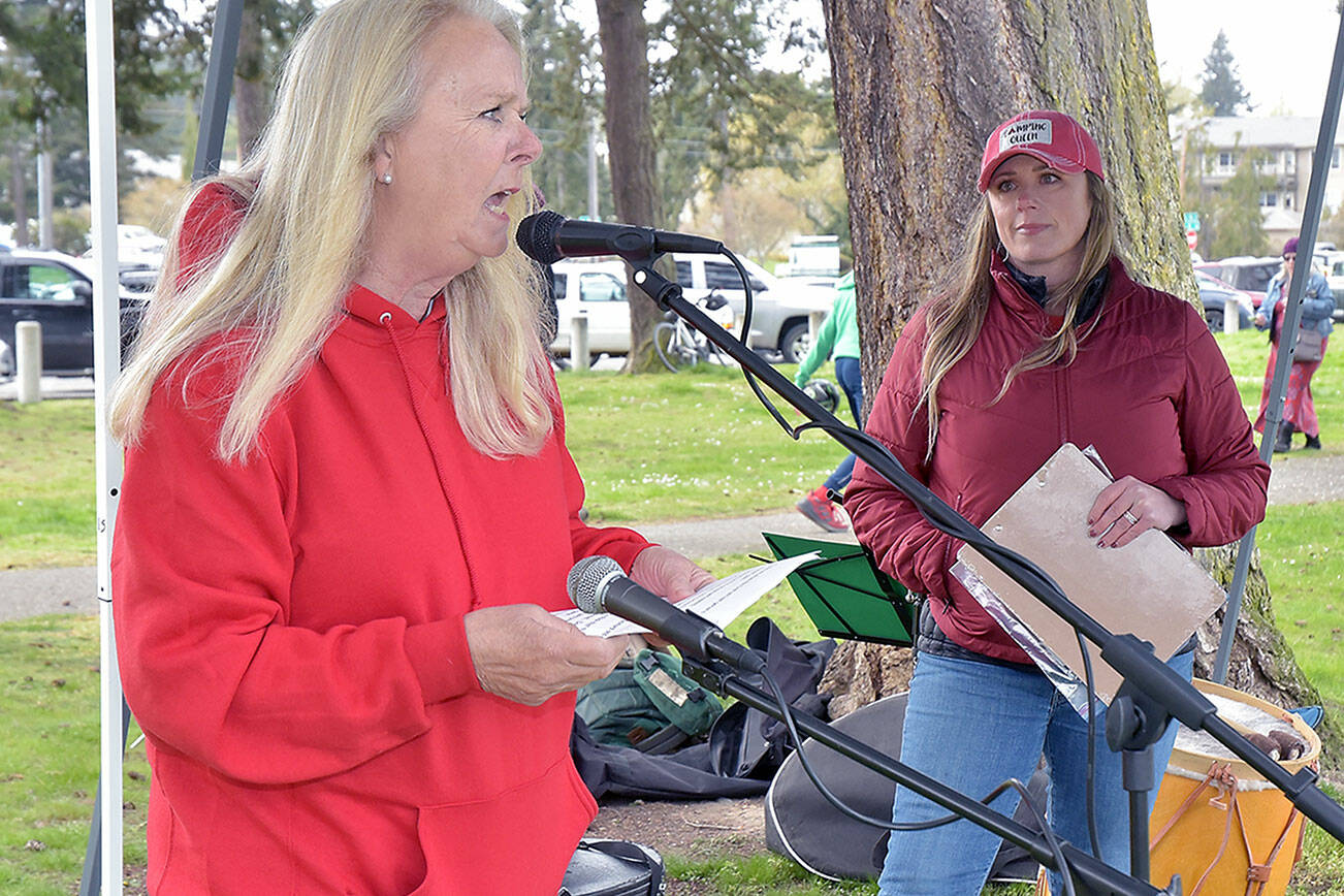 KEITH THORPE/PENINSULA DAILY NEWS
Retired teacher Nancy McCaleb speaks in support of striking paraeducators in the Port Angeles School District as Port Angeles Paraeducators Association President Rebecca Winters listens during a rally on Thursday at Shane Park.