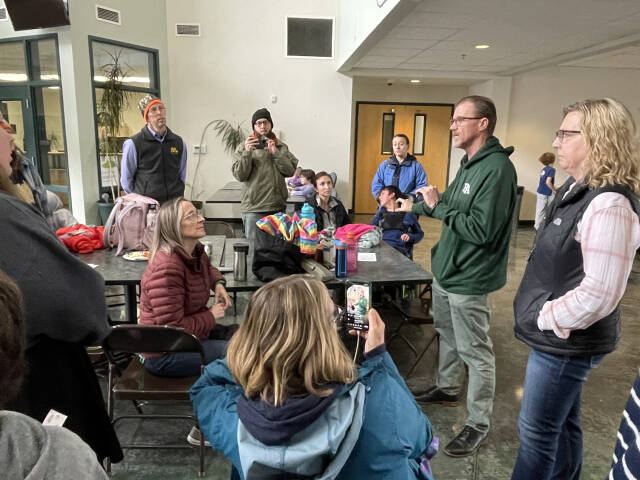 Port Angeles School Superintendent Marty Brewer, second from right, speaks with members of the Port Angeles Parents for Education, on Friday about the Port Angeles Paraeducation Association strike. Assistant Superintendent Michele Olsen stands at right. (Paula Hunt/Peninsula Daily News)