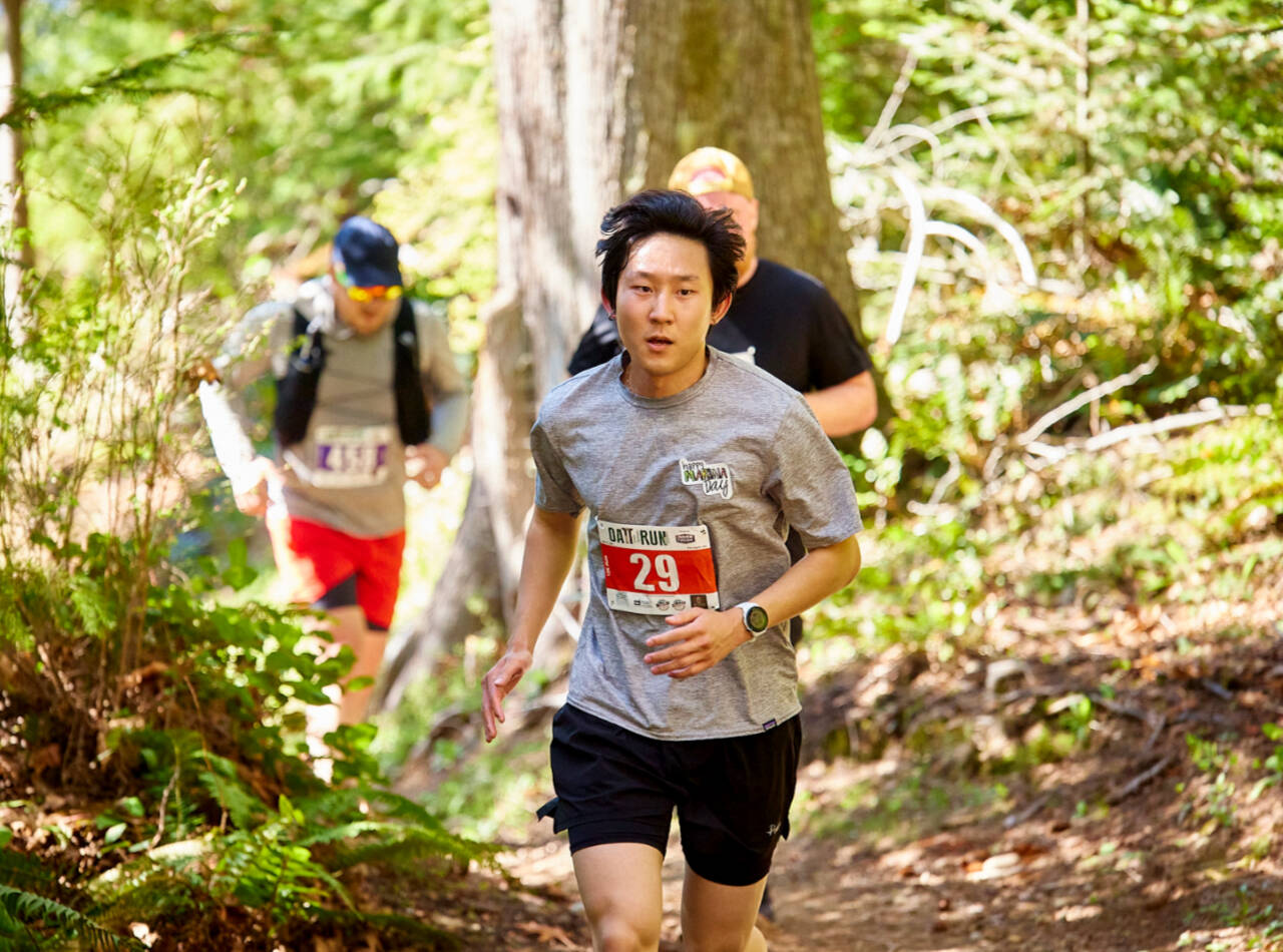 Nicholas Kim of Seattle (29), leads a pack of runners in the 12K race of the Olympic Adventure Trail run this weekend west of Port Angeles. (Matt Sagen/Cascadia Films)