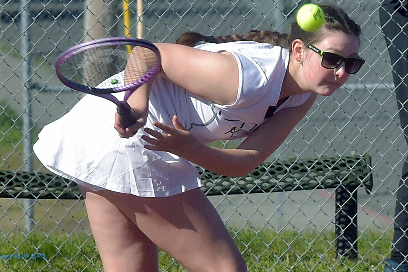 KEITH THORPE/PENINSULA DAILY NEWS
Port Angeles' Waverly Mead leans low for the return during her singles match against Bainbridge's Izzy Wallin on Wednesday afternoon in Port Angeles.