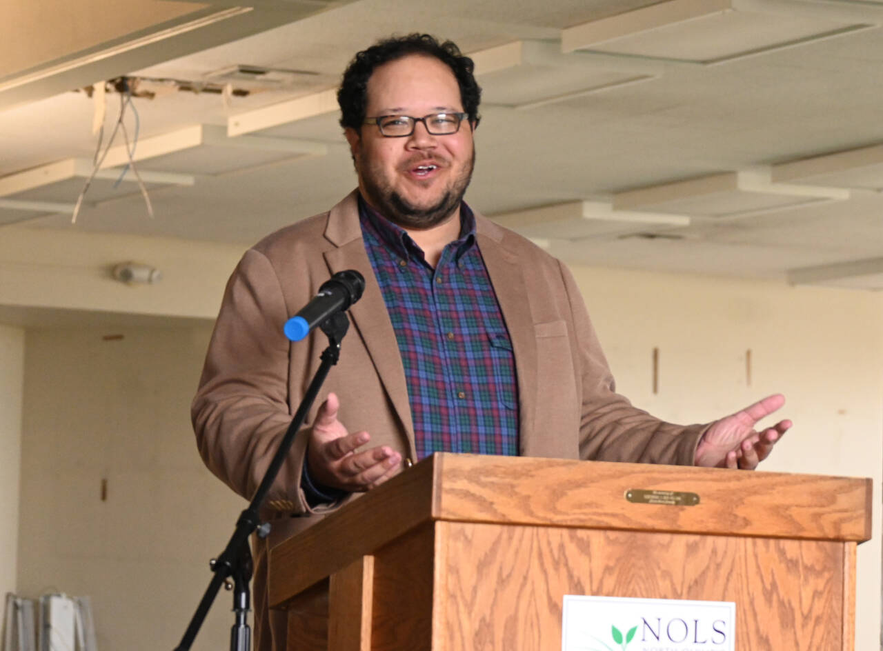 Noah Glaude, executive director of the North Olympic Library System, welcomes a crowd to the ceremonial groundbreaking of the Sequim Library expansion on Wednesday. (Michael Dashiell/Olympic Peninsula News Group)