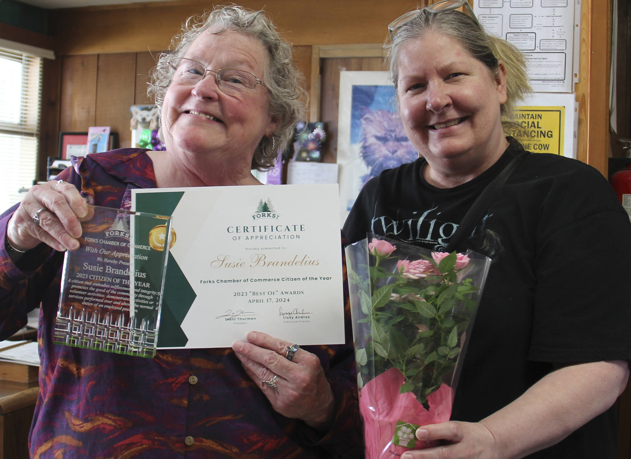 Citizen of the Year Susie Brandelius with the Forks Chamber of Commerce Executive Director Lissy Andros, who caught up with Brandelius on Monday to present her award and flowers. (Christi Baron/Olympic Peninsula News Group)